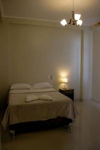Un pat sau paturi într-o cameră la Hostel Willys House