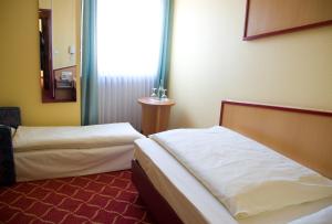 Postel nebo postele na pokoji v ubytování Montana Hotel