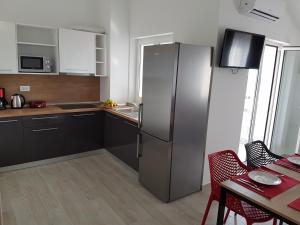 Kuchyň nebo kuchyňský kout v ubytování Apartments Kiara