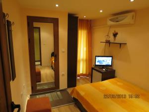 A bed or beds in a room at Family Hotel Lebed