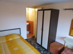 A bed or beds in a room at Family Hotel Lebed