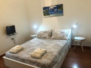 En eller flere senge i et værelse på Casa del sole