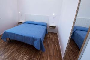 Llit o llits en una habitació de apARTments Sperlonga