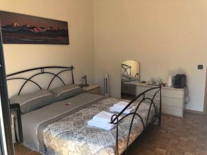 a bedroom with a bed and a mirror at Casa Ines in Bellinzona +12 photos