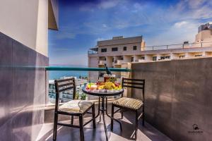 a table with a bowl of fruit on a balcony at Turists Vacation Sea of Galilee in Tiberias