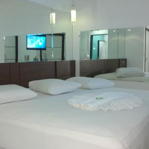 เตียงในห้องที่ Ele e Ela Motel (Adult Only)