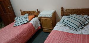 Postelja oz. postelje v sobi nastanitve Hotel Santusa