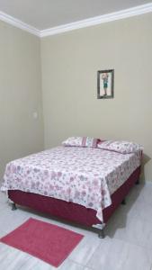 Ένα ή περισσότερα κρεβάτια σε δωμάτιο στο Chalés Porto do Céu