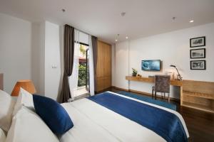 Postel nebo postele na pokoji v ubytování Hanoi Paon Hotel & Spa