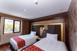 Letto o letti in una camera di Yawar Inka Hotel