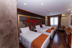 Letto o letti in una camera di Yawar Inka Hotel