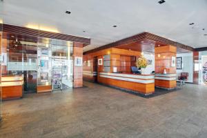 a lobby of a building with a room with glass at The Promenade in Puducherry