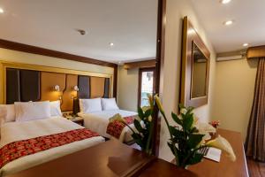 Letto o letti in una camera di Yawar Inka Hotel