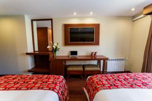 Letto o letti in una camera di Yawar Inka Hotel