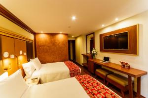 Letto o letti in una camera di Yawar Inka Hotel
