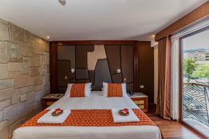 Letto o letti in una camera di Yawar Inka Hotel