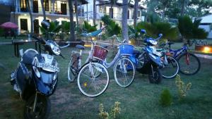 a group of bikes parked in the grass at Crescent Sea Resort in Nilaveli