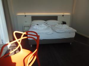Voodi või voodid majutusasutuse Albergo Dongo toas