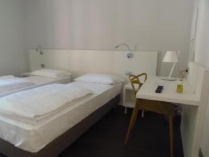 Voodi või voodid majutusasutuse Albergo Dongo toas