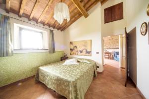 Postel nebo postele na pokoji v ubytování Agriturismo Il Caggio + 37 fotografií