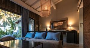 a living room with a couch and a table at Domaine Tarbouriech, Demeure & Spa in Marseillan