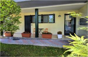 a house with potted plants on a patio at Ca' Claudia Venezia in Mestre