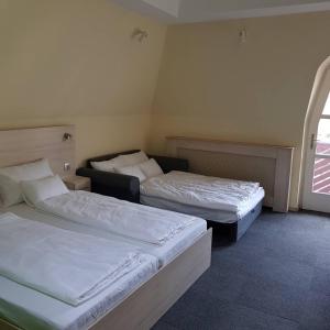 Postel nebo postele na pokoji v ubytování Grantek Üdülőház