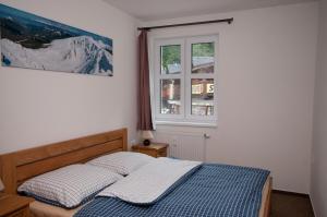 Posteľ alebo postele v izbe v ubytovaní Apartmány Biela Púť - Jasná nr. 3