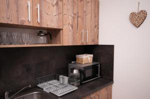 Kuchyňa alebo kuchynka v ubytovaní Apartmány Biela Púť - Jasná nr. 3