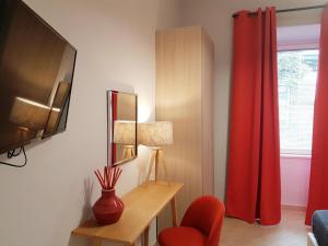 TV a/nebo společenská místnost v ubytování Solfatara Suites B&B