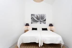 A bed or beds in a room at Casa María - Caserío de Guaza