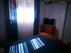 Telewizja i/lub zestaw kina domowego w obiekcie Dom nad Wigrami