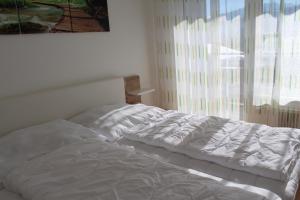 Postel nebo postele na pokoji v ubytování Familienapartment Sunnseitn