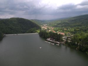 an aerial view of a lake with boats at Cabana Claris in Văliug