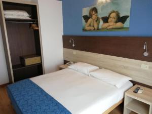 Postel nebo postele na pokoji v ubytování Hotel Lory My Wellness SPA
