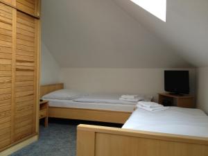 Кровать или кровати в номере Pension Filip