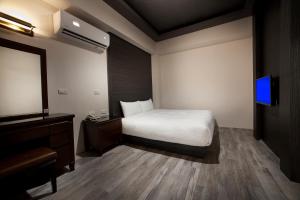 Letto o letti in una camera di Two Fukun Hotel