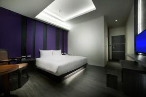 Letto o letti in una camera di Two Fukun Hotel