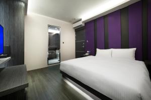 Letto o letti in una camera di Two Fukun Hotel