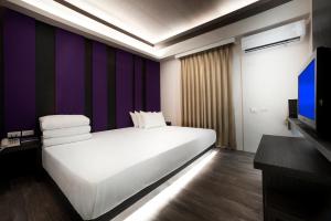 Letto o letti in una camera di Two Fukun Hotel