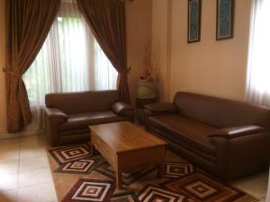 O zonă de relaxare la Ada Waktu Homestay