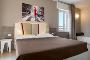Postel nebo postele na pokoji v ubytování Guesthouse Verona