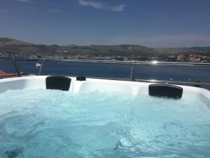 a hot tub on a boat in the water at Villa Luna in Trogir