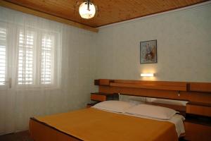 Postel nebo postele na pokoji v ubytování Guesthouse Mimas