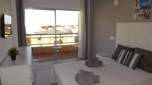 Postel nebo postele na pokoji v ubytování Hotel Carlos I