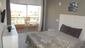 Postel nebo postele na pokoji v ubytování Hotel Carlos I