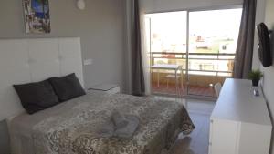 Postel nebo postele na pokoji v ubytování Hotel Carlos I