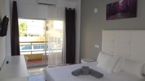 Postel nebo postele na pokoji v ubytování Hotel Carlos I