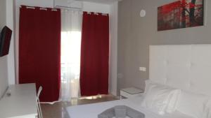 Postel nebo postele na pokoji v ubytování Hotel Carlos I