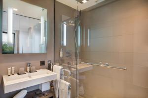 a bathroom with a sink and a mirror at BW Premier Collection Le Saint Antoine Hotel et Spa in Rennes